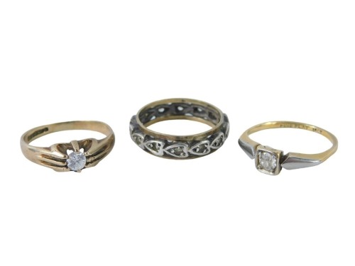 Three dress rings, comprising a 9ct gold CZ set solitaire ring, ring size J, an 18ct gold and platinum diamond set dress ring, ring size I½, and a 9ct gold and silver eternity ring, ring size I½, 3.4g all in. (3)