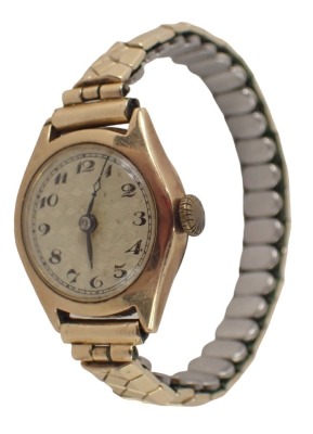 A 9ct gold cased wristwatch, with silver numeric dial, black hands, on expanding gold plated strap, 16.5g all in.