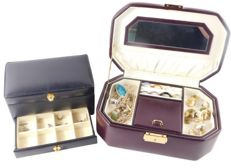 A brown leatherette jewellery box and contents, to include dress rings, military buttons, hard stone dress rings, etc. and a black leatherette wristwatch case. (2)