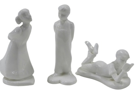 Three Royal Doulton Images figures, comprising Studious Boy, The Kiss Boy and The Kiss Girl, the largest 12cm high. (3)