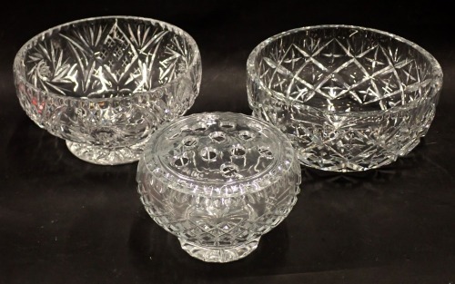 Three cut crystal glass fruit bowls, one with star design, 21cm wide, a highly fluted example, 19cm wide, and a rose bowl, 11cm high. (3)