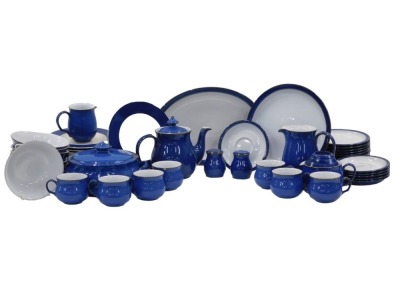 A Denby Dark Blue pattern part tea and dinner service, comprising teapot, six teacups, six saucers, nine side plates, four medium plates, six dinner plates, oval serving tray, milk jug, gravy boat, oval meat plate, salt and pepper, tureen and cover, and s