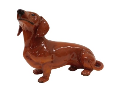 A large Beswick dachshund, stamped to underside, 30cm wide. (AF)