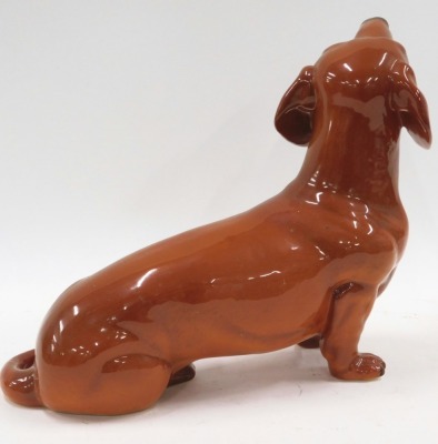 A large Beswick dachshund, stamped to underside, 30cm wide. (AF) - 2