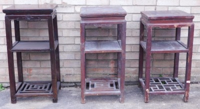 Three similar Chinese three tier occasional tables, each with a raised undertier and lattice base, 75cm high, 39cm wide etc. (AF)