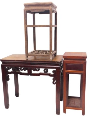 A Chinese table, rectangular top above a pierced and carved frieze on shaped supports, 74cm high, 92cm wide, and two urn tables. (3) (AF)