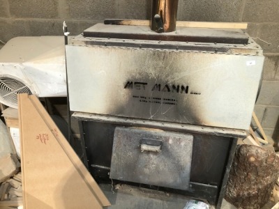 A MET MANN woodburning stove heater.