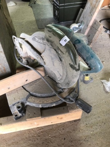 A Makita MLS 100 circular saw, 110 volt.