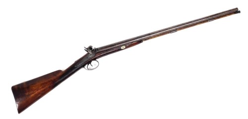 A double barrel side by side percussion shotgun, marked Tetly to side plate, overall length 113cm, barrel length 70.5cm.