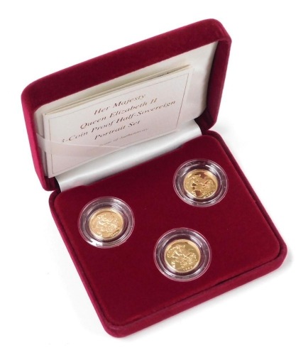 An Her Majesty Queen Elizabeth II three coin proof half sovereign portrait set, boxed with certificate, comprising 1984, 1986 and 2004, approximately 12g.