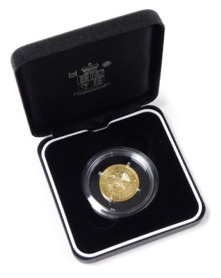 A 2007 Russian gold 50 rubles coin, the obverse with the emblem of The Bank of Russia, a two headed eagle, reverse with St George The Victorious, approximately 7.89g.