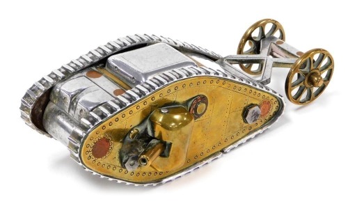 A WWI trench art model of a British Mk 1 tank, with moveable side guns, and rear wheels, 14.5cm wide.