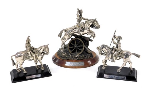 A pair of pewter military figures, mounted on horseback, raised on a wooden base, comprising the Blues & Royals, and 21st (Empress of India's) Lancers 1905, together with a Royal Hampshire figure group of the 8th Hussars, modelled by Richard Hanley, showi