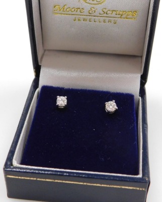 A pair of diamond stud earrings, claw set in white metal, stamped 750, approximately 0.5ct, 1.2g.