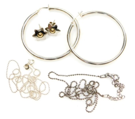 A pair of white and yellow metal earrings, of floral form, stamped 9k, 1.1g, together with a pair of silver hoop earrings, and two silver chains.