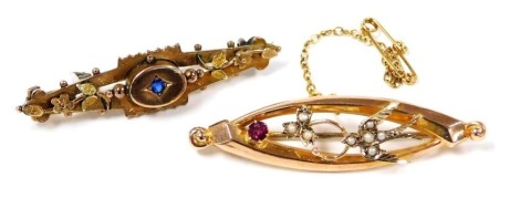 A Victorian 9ct gold seed pearl and single stone set brooch, decorated with a swallow, leaf, and berry, and a further 9ct gold brooch, with a floral design and central oval mounted blue paste, 4.8g.