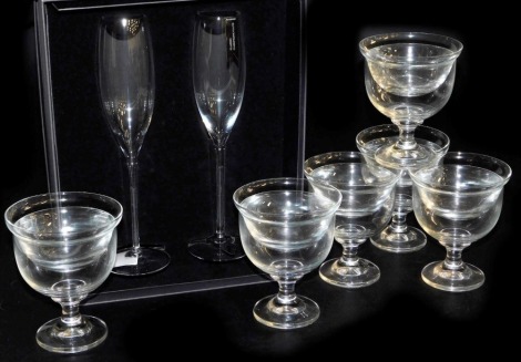 A pair of Waterford Elegance Collection champagne classic flutes, boxed, together with six Zwiesel glass fruit cocktail dishes, boxed.