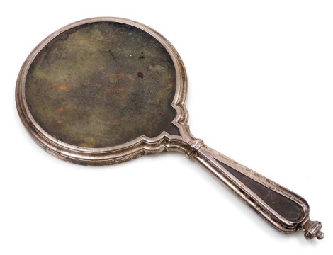 A George V silver and tortoise shell backed hand mirror, London 1925.