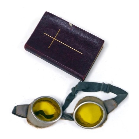 A pair of WWI triplex tinted flying goggles, together with a Book of Common Prayer, dedicated "E Spafford Weston, given her by her son John William, Farrier Srgt in the S.R.T.Y whilst stationed at Harford, October 18th 1915". (2)