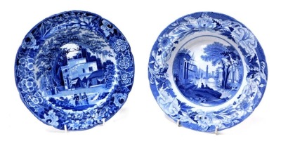 An early 19thC Wedgwood blue and white soup plate, transfer decorated in the Blue Claude pattern, impressed marks, together with a Riley blue and white soup plate, transfer decorated with an Eastern street scene. (2)