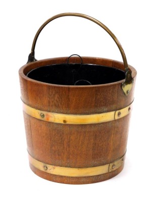 An oak and brass bound coal bucket, with metal liner, 37.5cm high.