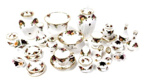 A group of Royal Albert Old Country Roses porcelain, including vases, boxes and covers, bells, dressing table boxes, and other ornaments, and a teacup and saucer.