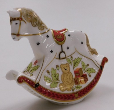 A group of ceramics, including a Caverswall scent bottle, painted by WR Tipton with hunting scenes, a Royal Crown Derby rocking horse paperweight, Coalport Caughley mask-head jug, and a Royal Worcester porcelain pillar box. - 6