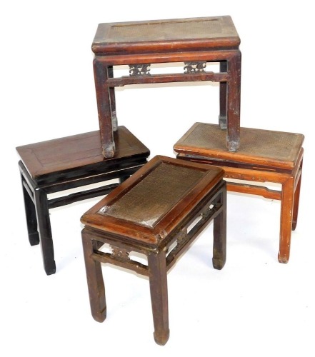 Four Chinese hardwood stools, three with rattan seats, 50cm high, 51-56cm wide.