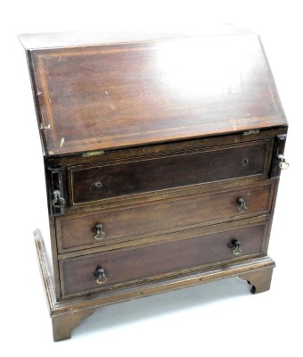 A late Victorian mahogany apprentice bureau, with satin wood cross banding, the fall flap opening to reveal a central door flanked by four recesses, over three graduated drawers, raised on bracket feet, 46.5cm high, 40cm wide, 24cm deep.