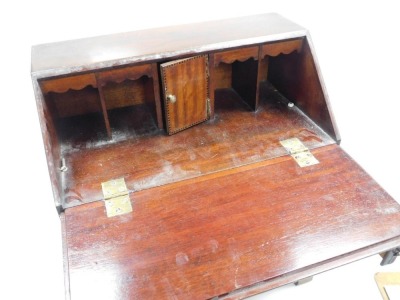 A late Victorian mahogany apprentice bureau, with satin wood cross banding, the fall flap opening to reveal a central door flanked by four recesses, over three graduated drawers, raised on bracket feet, 46.5cm high, 40cm wide, 24cm deep. - 2