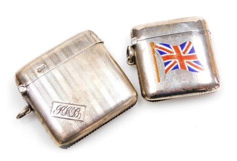 An Edward VII silver and enamel Vesta case, decorated with the Union Flag, Birmingham 1901, and a George V silver Vesta case, with engine turned banding and rectangular reserve, monogram engraved, Chester 1911. (2)