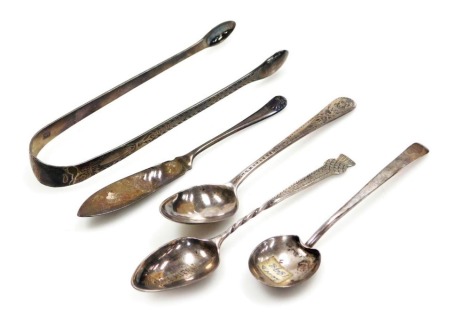 A pair of George III silver sugar tongs, with bright cut engraving, Thomas Wallace II, London 1796, three Georgian and later teaspoons, and a silver butter knife, 2.49oz.