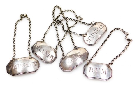 Five George III silver decanter labels, with chains, named for Rum, Gin, Madeira, Brandy, and Whiskey, 1.09oz.