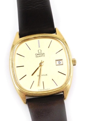 An Omega DeVille gentleman's gold plated wristwatch, circa 1978, square dial with gilt batons, date aperture, quartz movement, on a leather strap, boxed with guarantee.