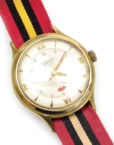 A mid century Junghans gentleman's gold plated wristwatch, circular silvered dial with Roman numerals at quarters, centre seconds, date aperture, twenty-two jewelled movement, on a fabric strap.