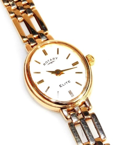 A Rotary Elite lady's 9ct gold cased wristwatch, oval white dial bearing gold batons, on a 9ct gold gate bracelet, boxed, with warranty and guarantee, 17.2g all in.