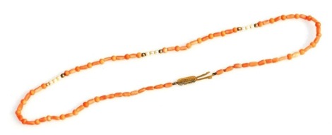 A 9ct gold coral and seed pearl necklace, 43cm long.