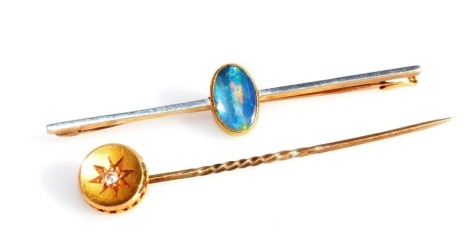 An Edwardian opal bar brooch, set in yellow metal, stamped 15ct, and a diamond set tie pin, set in yellow metal, stamped 15ct, 3.4g. (2)