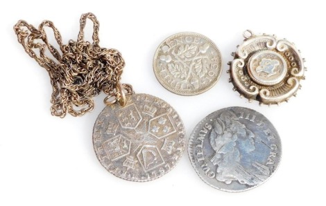 A William III silver sixpence 1696, George III silver sixpence 1787, holed with chain suspension silver medallion, and a George V thrupenny bit 1934, holed.