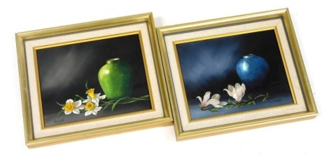 J Ward (British late 20thC). Still life of magnolias and blue vase, still life of daffodils and green vase, pair of oils on canvas, signed, 19cm x 24.5cm.