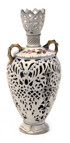 A late 19thC Rudolstadt porcelain twin handled vase, of baluster form, with reticulated decoration, the shoulder painted with a band of flowers, printed mark, 23cm high.