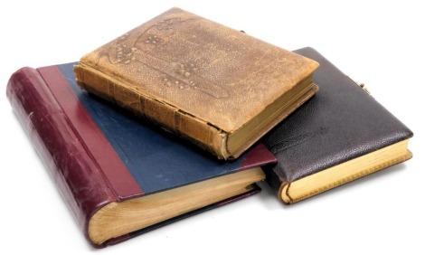 Two Victorian tooled leather portrait photograph albums, together with a red half Morocco and cloth bound scrap book. (3)