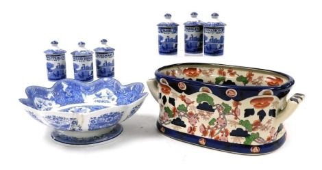 A Spode pottery floral footed bowl, limited edition no. 550 for Compton & Woodhouse, together with six Copeland Spode Italian herb jars and an Ironstone twin handled foot bath. (8)