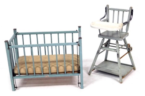 A Tri-ang blue painted wooden doll's cot, 58cm wide, together with a metamorphic child's chair, 59.5cm high. (2)