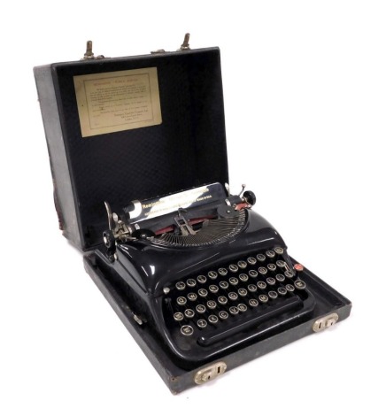 A Remington portable typewriter, no. W365634, cased.