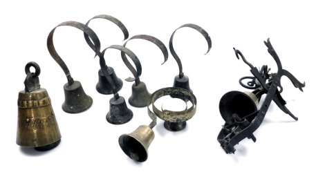 A group of brass and metal servant's bells, each on a cast iron frame, and a cow bell. (a quantity)