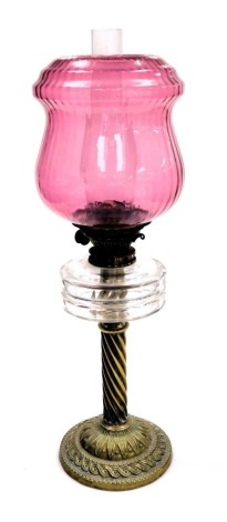 A late 19thC Richard Patterson & Company Hicks patent brass and cut glass oil lamp, with glass chimney and frilled pink glass shade, 63.5cm high.