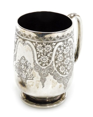 A Victorian silver mug, with engraved floral decoration, reserve monogram, John Aldwinckle and Thomas Slater, London 1891, 3.99oz. (AF)