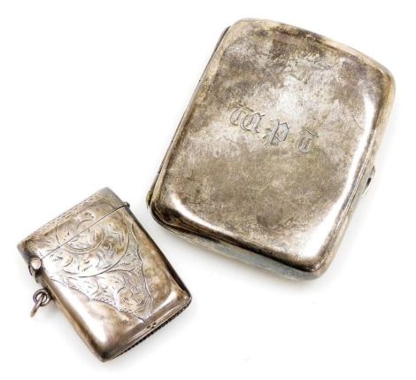 An Edward VII silver cigarette case, monogram engraved, Birmingham 1901, and a further silver Vesta case, with foliate engraving, Birmingham 1908, 2.72oz.