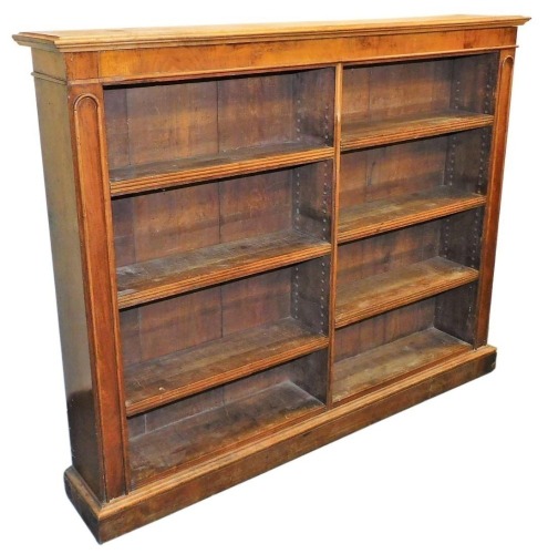 A Victorian mahogany open bookcase, bisected, with six shelves, raised on a plinth base, 120cm high, 150cm wide, 26.5cm deep.